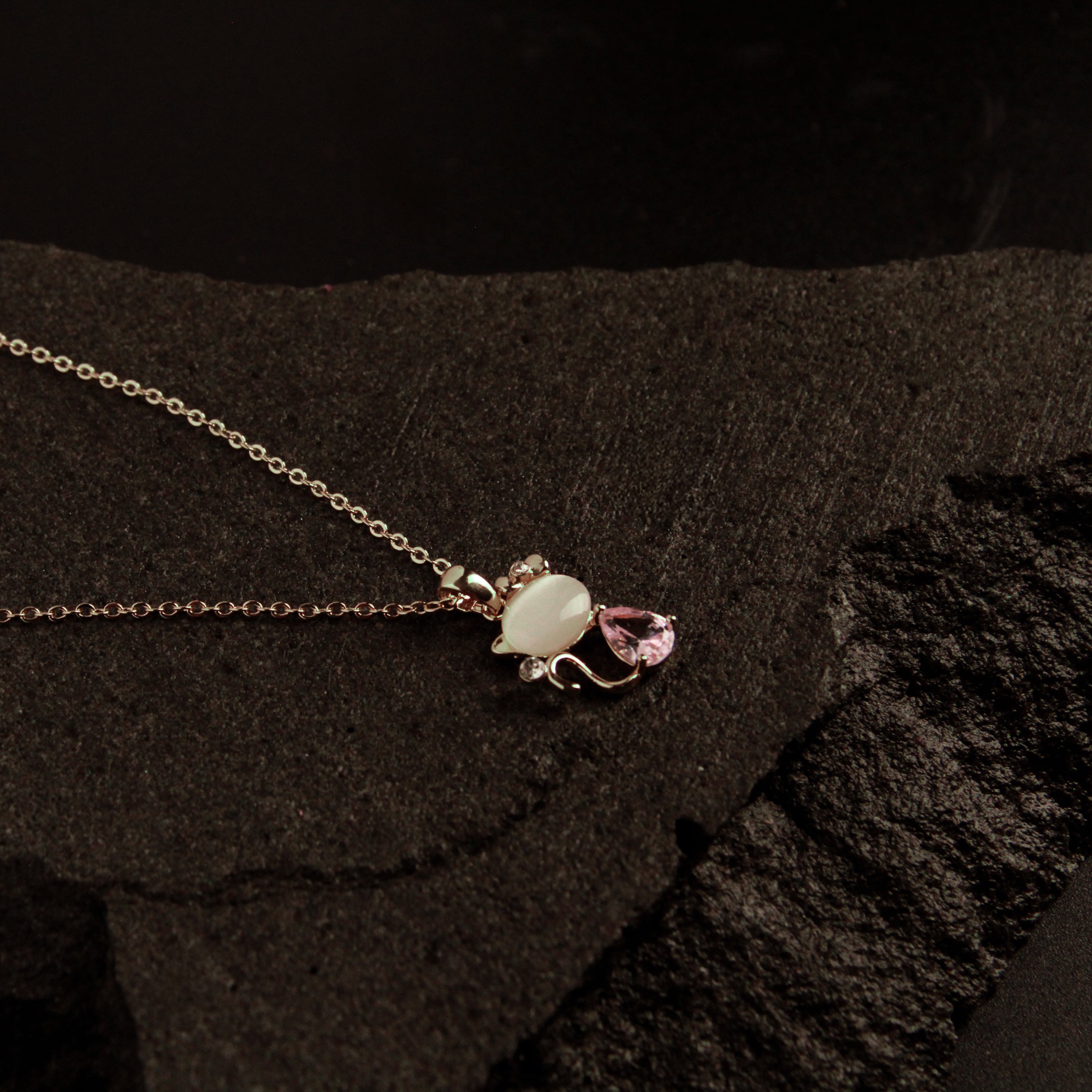 Elegant gold cat necklace featuring soft stone and crystal accents, feminine jewelry for cat lovers
