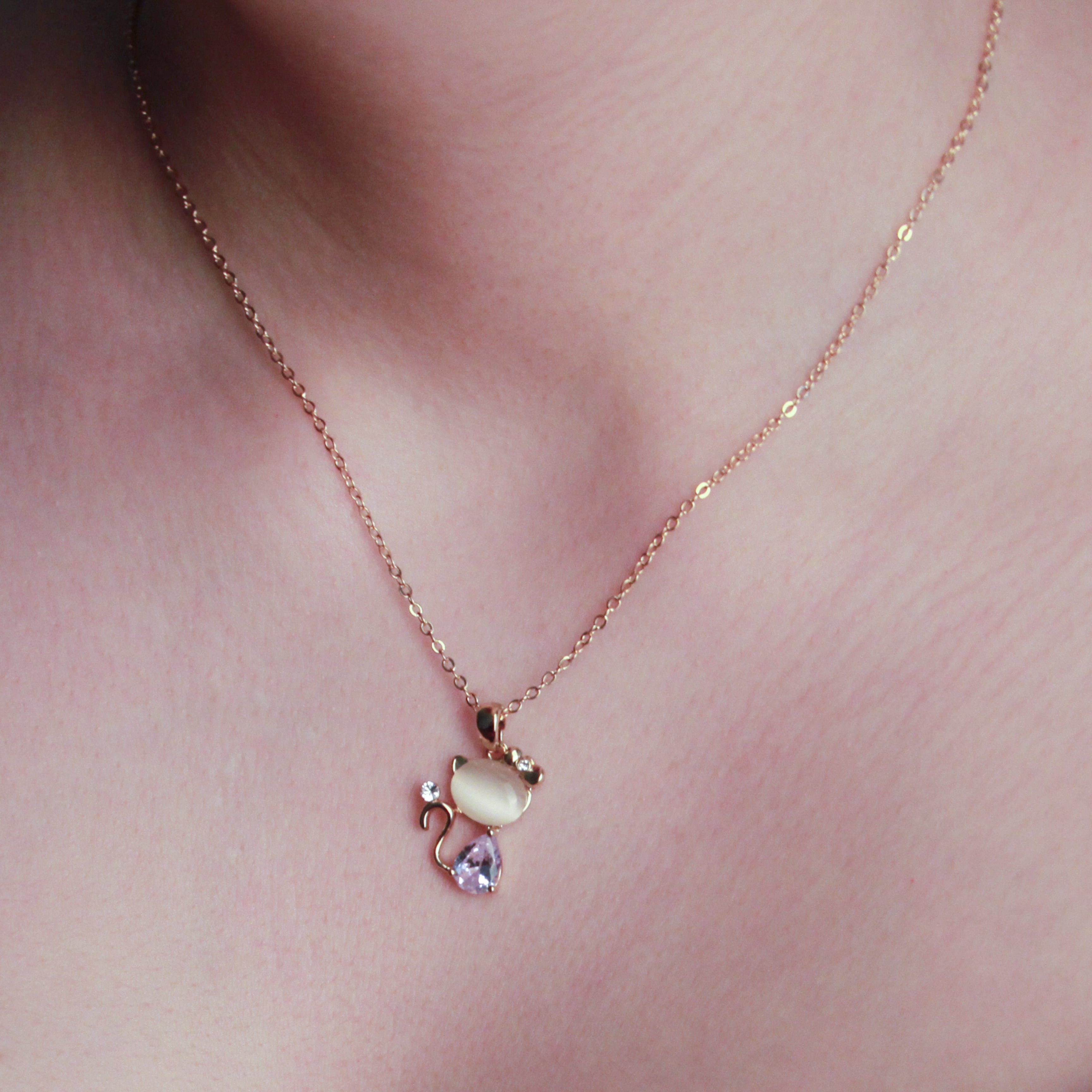 Gold-tone cat pendant necklace with sparkling crystal details, delicate everyday jewelry for women