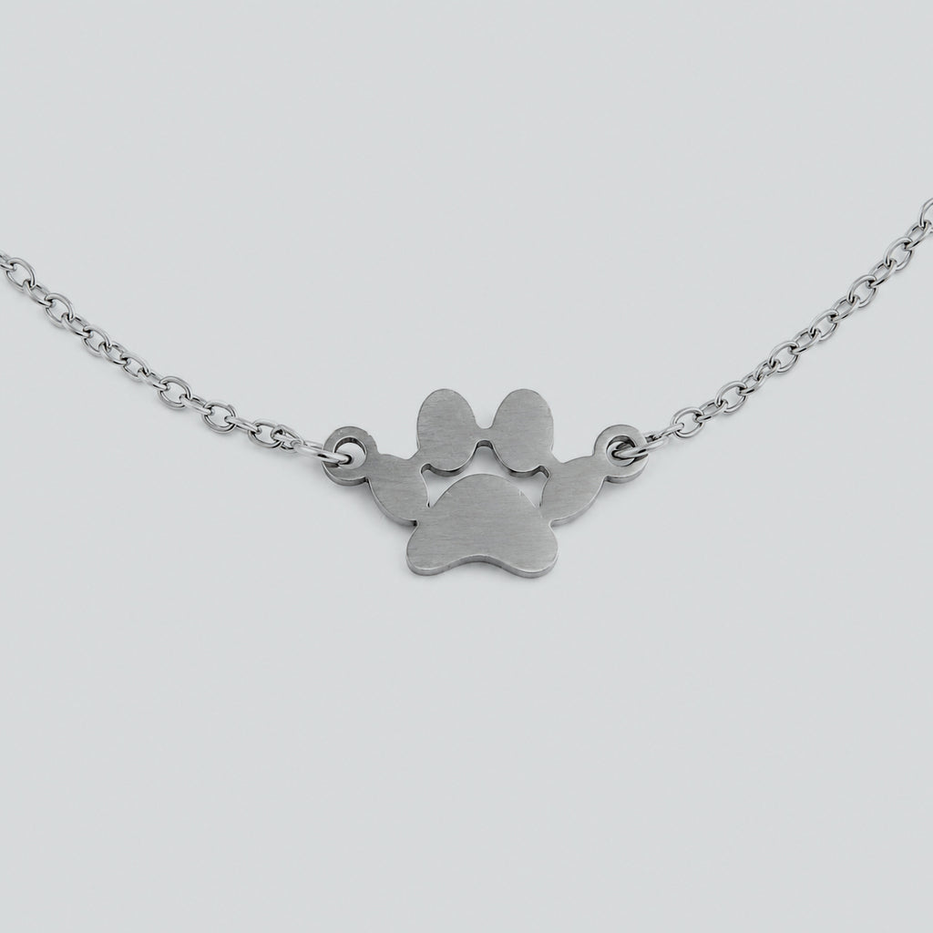 Layered silver cat bracelet with double chain links and cat charm, modern jewelry for cat lovers