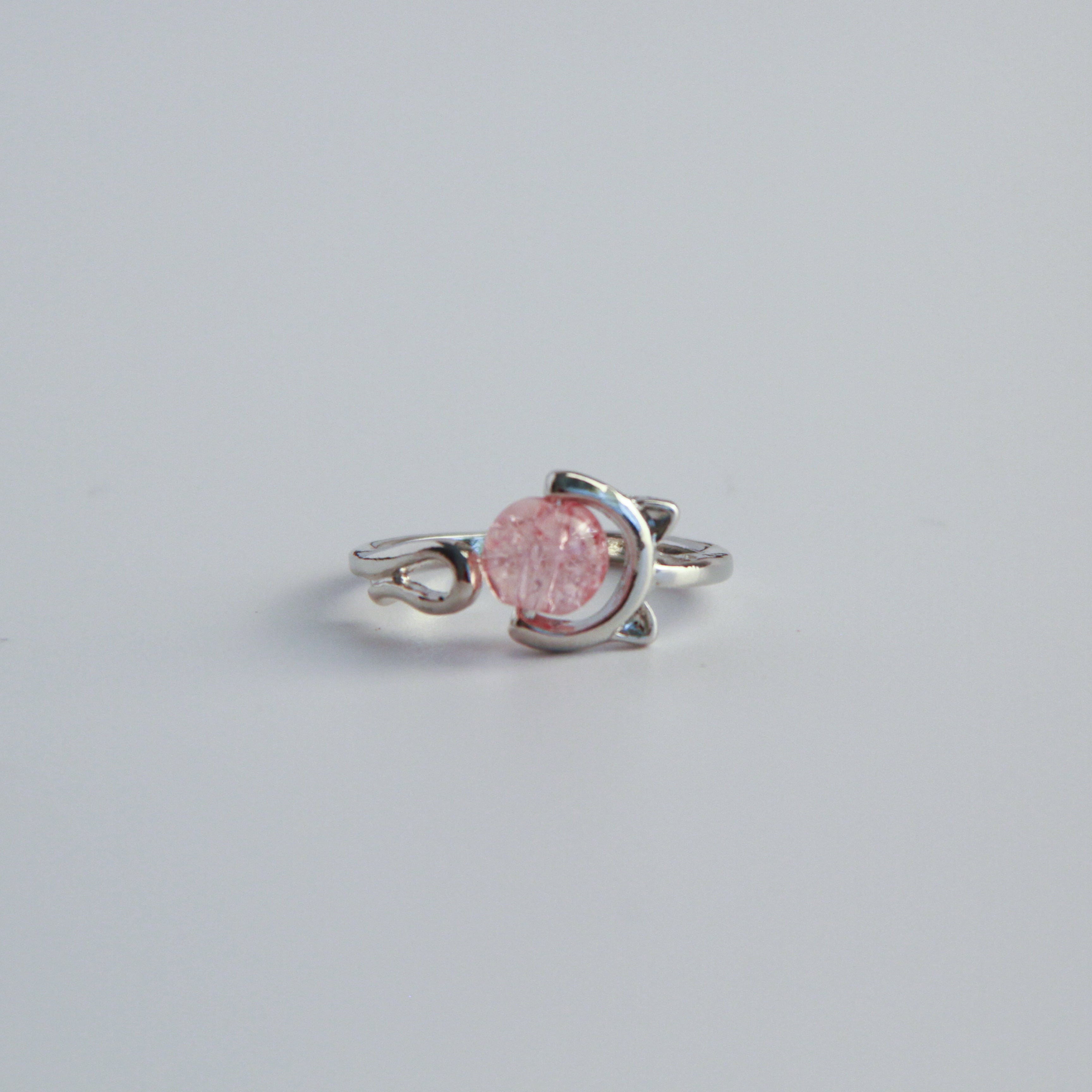 Adjustable silver cat ring with pink stone detail and minimalist cat design, elegant jewelry for women