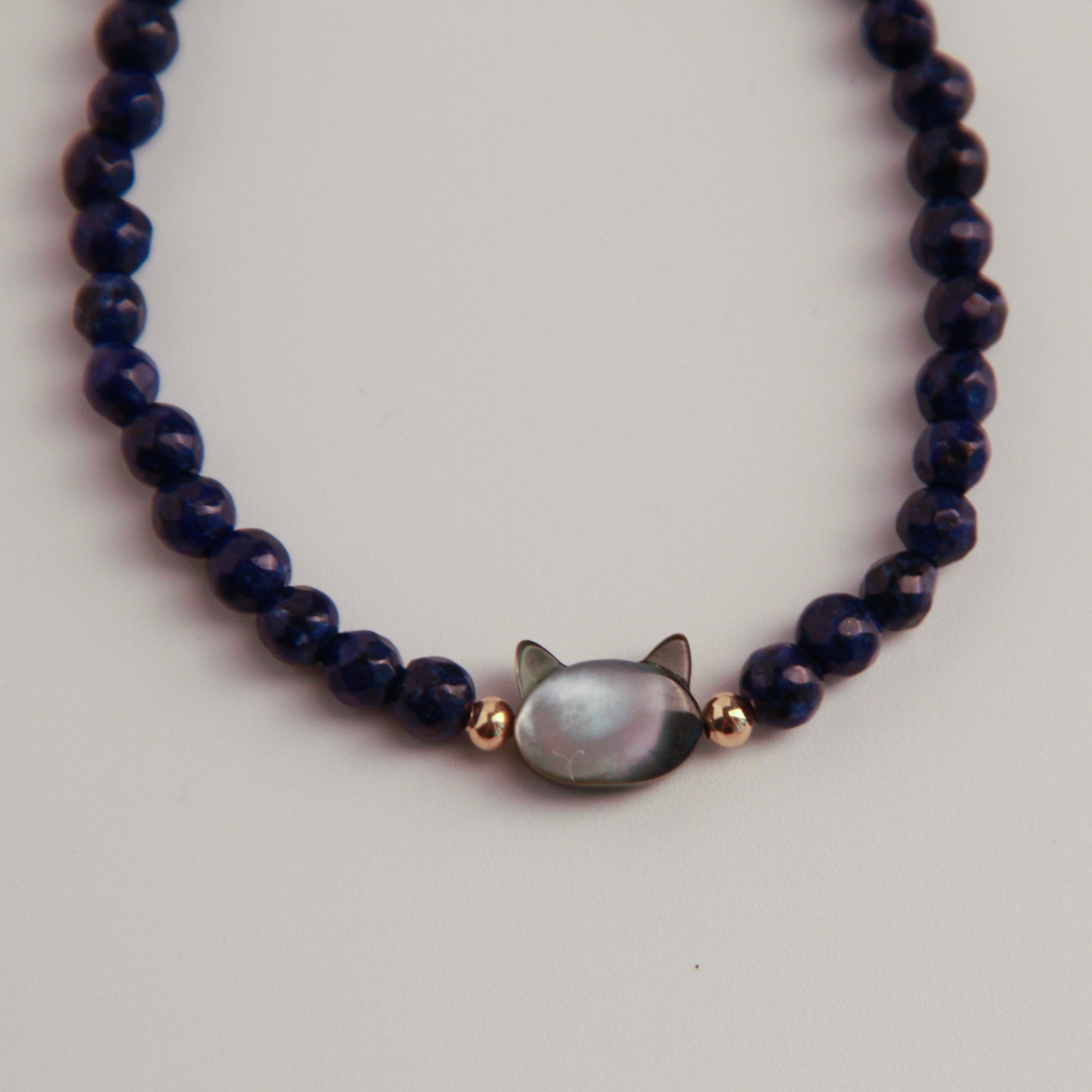 Silver cat bracelet with blue stone cat charm and beaded design, minimalist jewelry for cat lovers