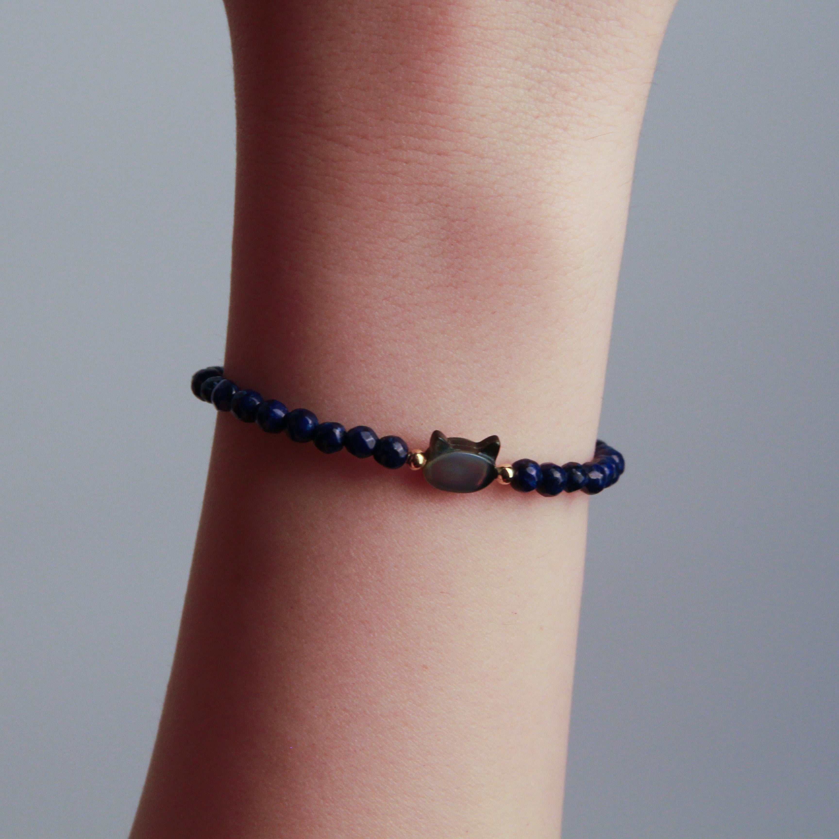 Silver cat bracelet with blue stone cat charm and beaded design, minimalist jewelry for cat lovers