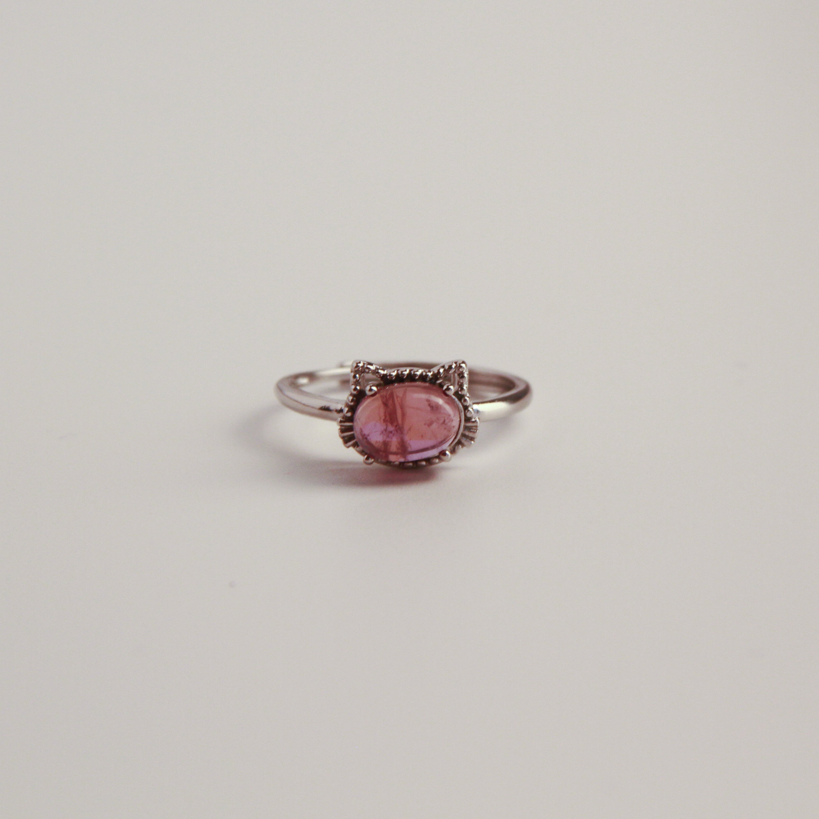 Silver cat ring with cat ear design and red stone detail, elegant jewelry for women