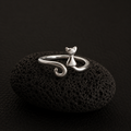 Curled Tail Cat Ring on black lava stone