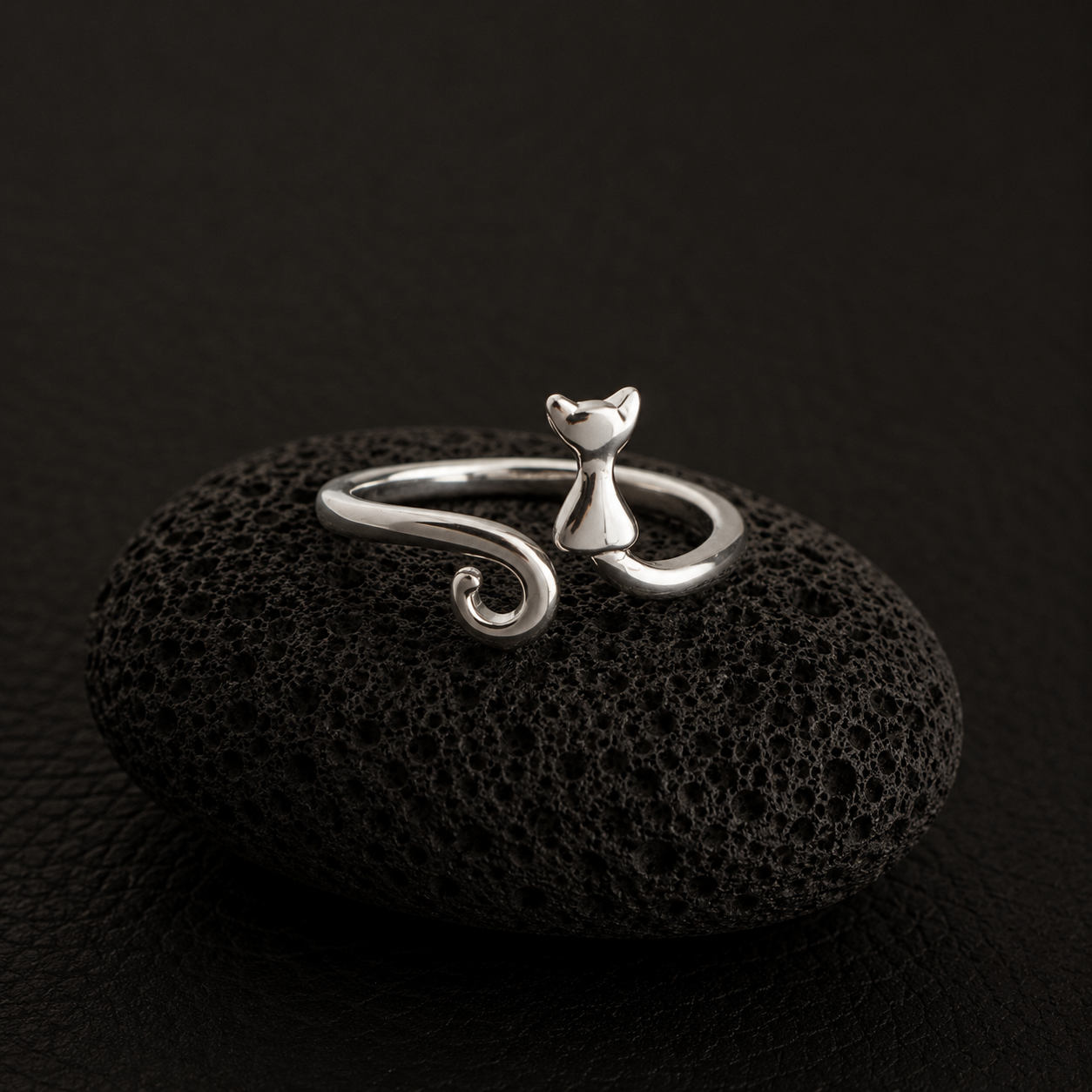 Curled Tail Cat Ring on black lava stone