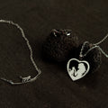Silver cat jewelry set featuring a cat bracelet, heart-shaped cat necklace, and adjustable ring, elegant gift for cat lovers