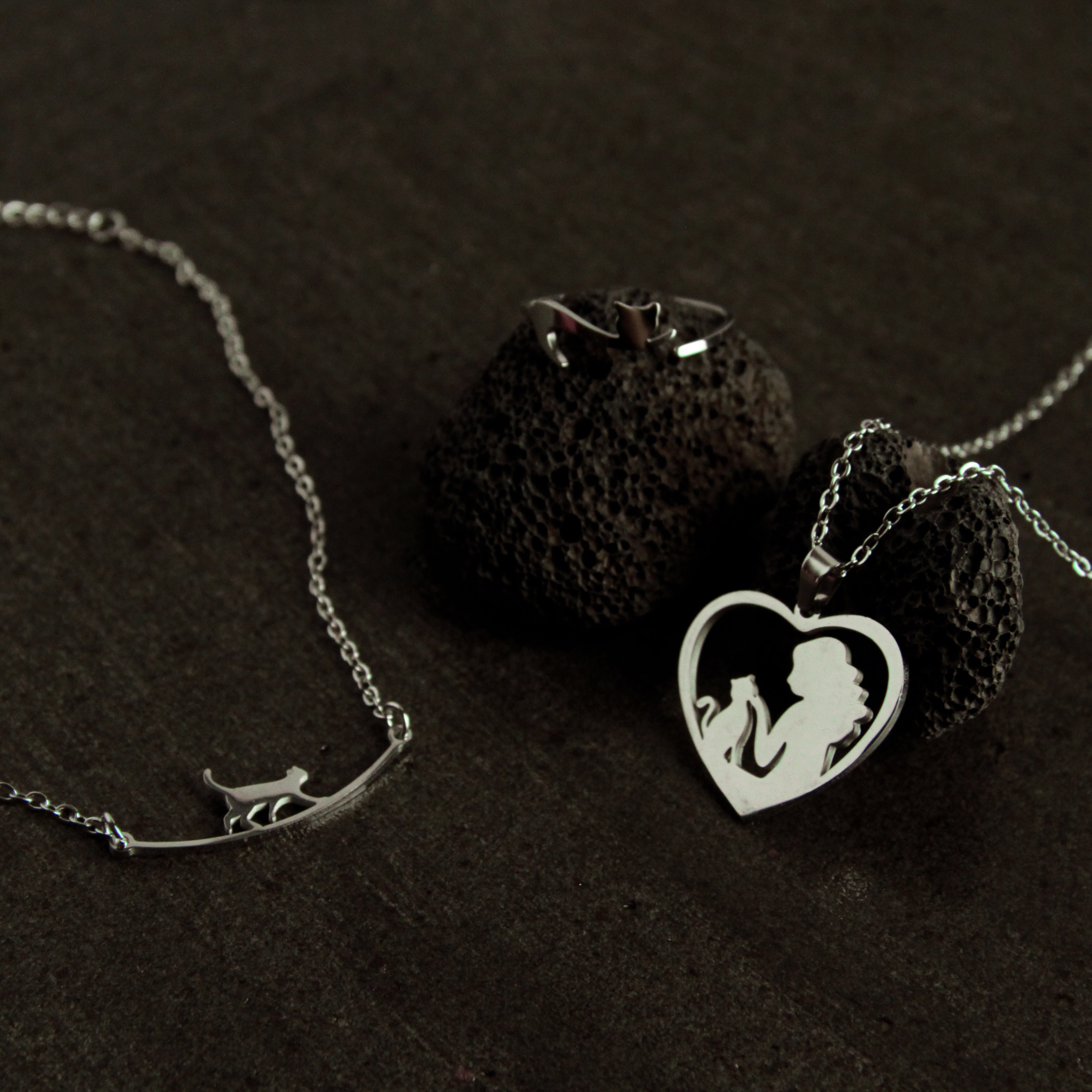 Silver cat jewelry set featuring a cat bracelet, heart-shaped cat necklace, and adjustable ring, elegant gift for cat lovers