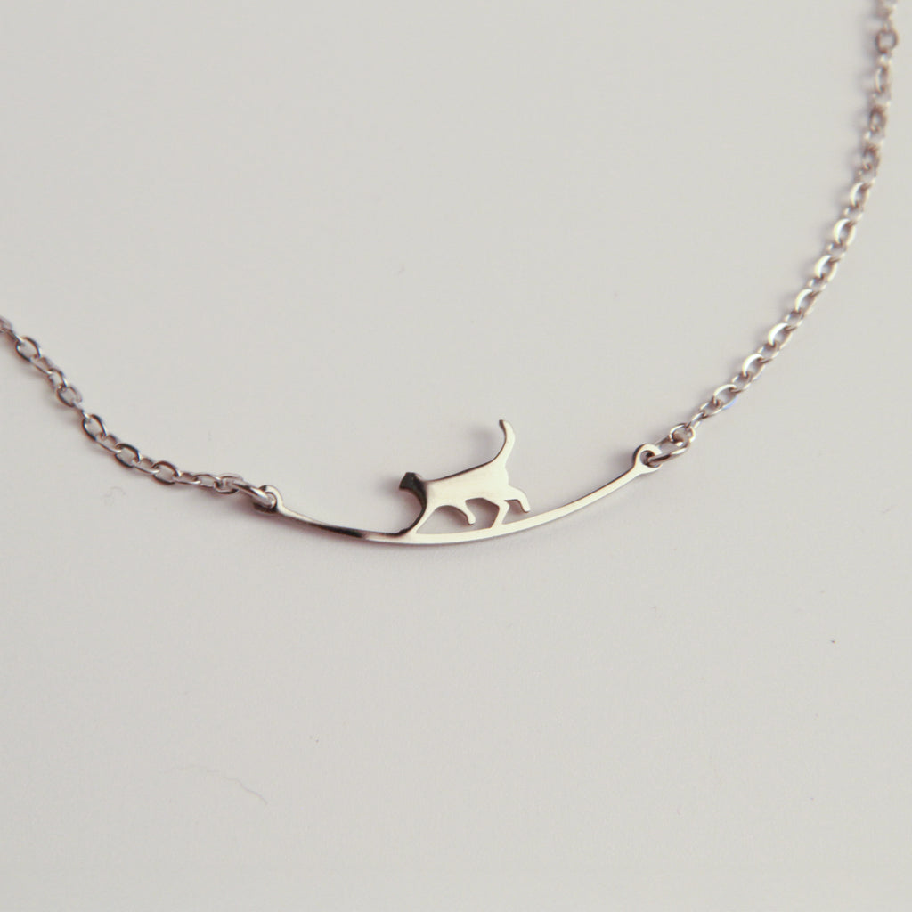 Minimalist silver cat bracelet with delicate cat silhouette, lightweight jewelry for everyday wear