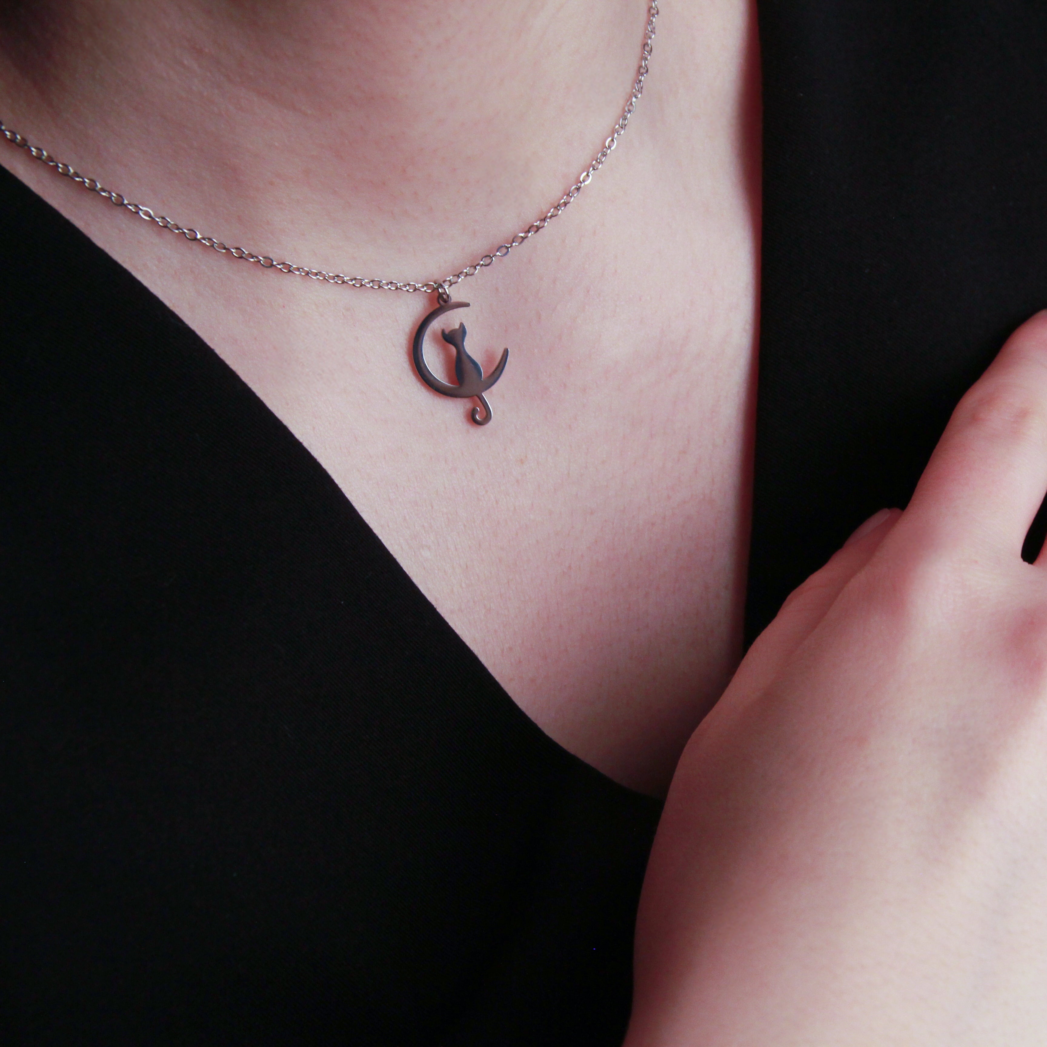 Silver cat necklace with curved cat silhouette pendant, minimalist jewelry for women
