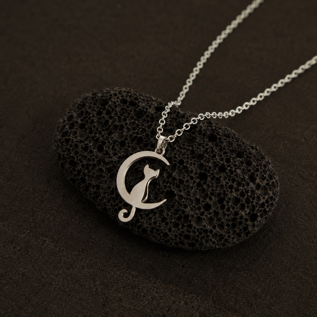 Close-up of Harmony Cat pendant necklace with flowing curved details