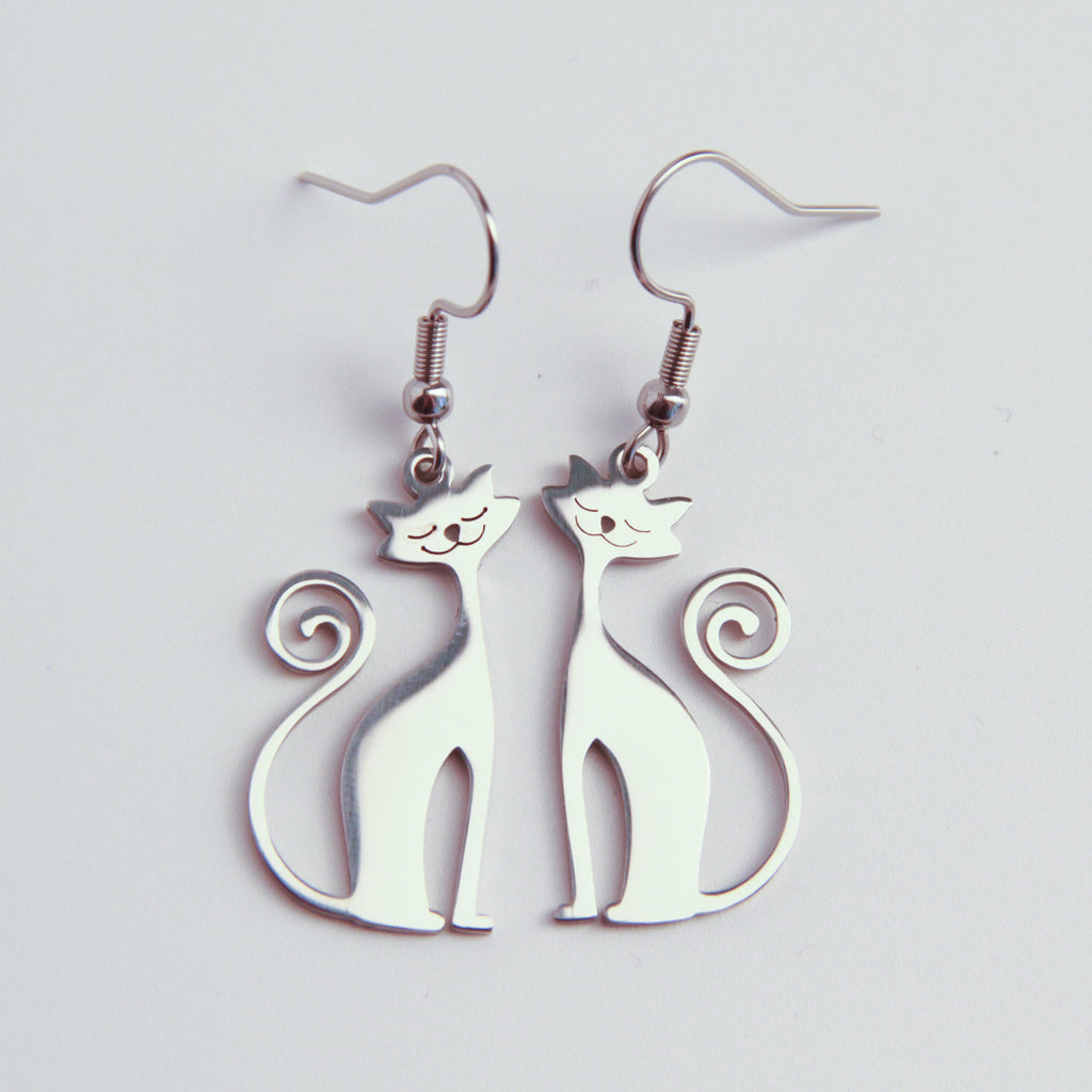Silver cat earrings with minimalist silhouette design, lightweight dangling jewelry for cat lovers