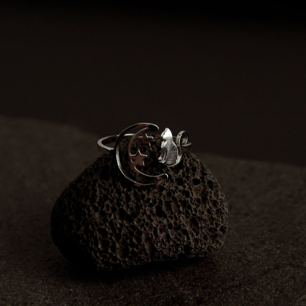 Adjustable sterling silver cat ring featuring moon and star details, elegant minimalist jewelry for cat lovers