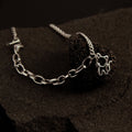 Modern layered silver cat bracelet featuring double chain links and a delicate cat charm, stylish jewelry for cat lovers
