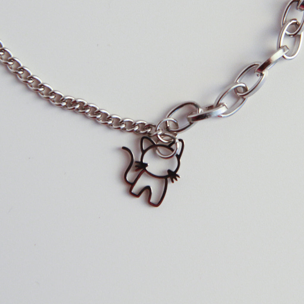 Layered silver cat bracelet with double chain links and cat charm, modern jewelry for cat lovers