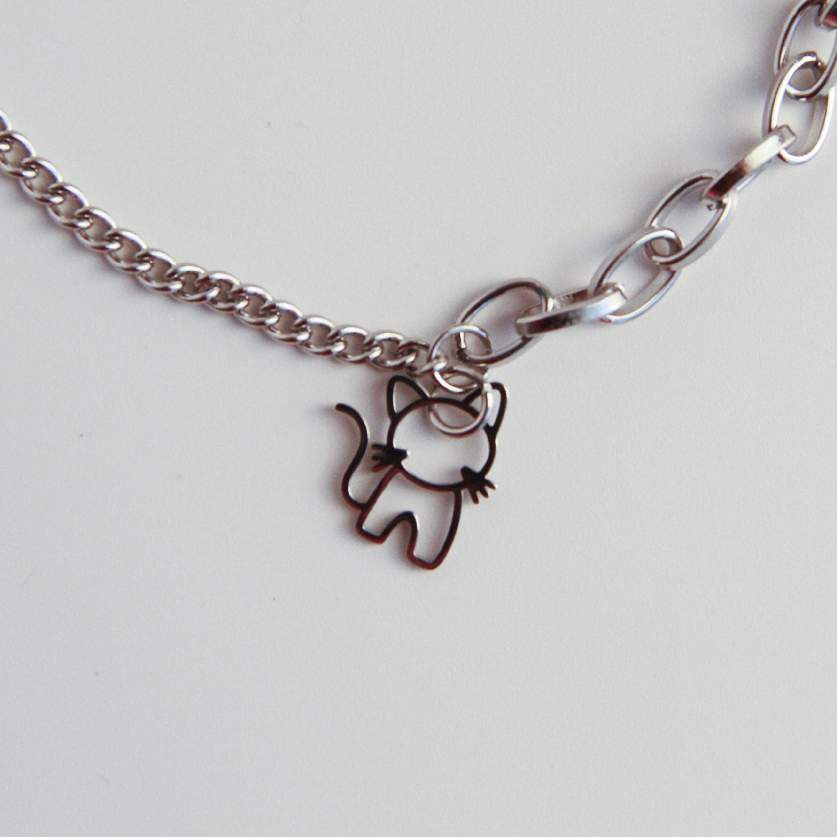 Layered silver cat bracelet with double chain links and cat charm, modern jewelry for cat lovers