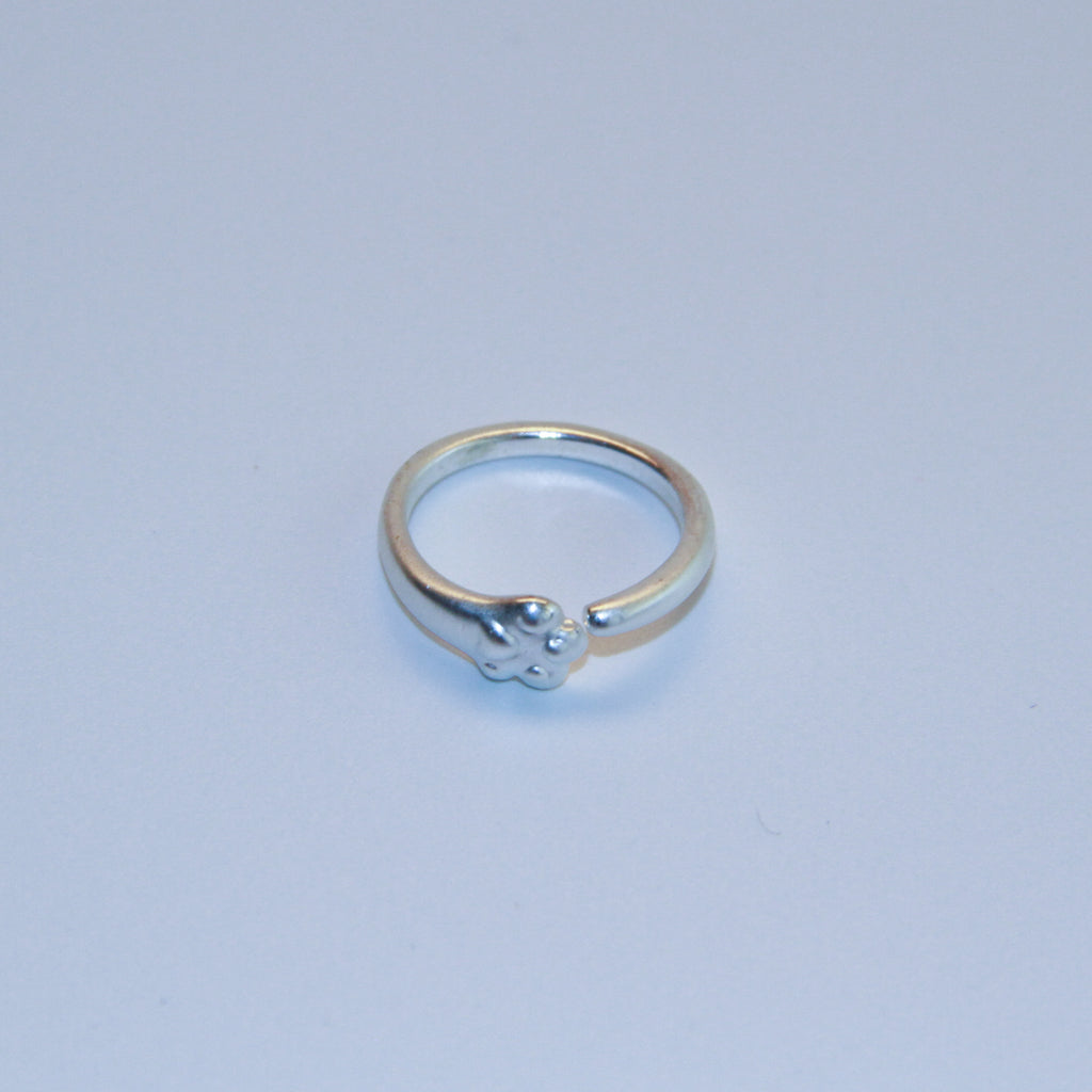 Adjustable silver paw ring with minimalist cat paw design, cute jewelry for cat lovers