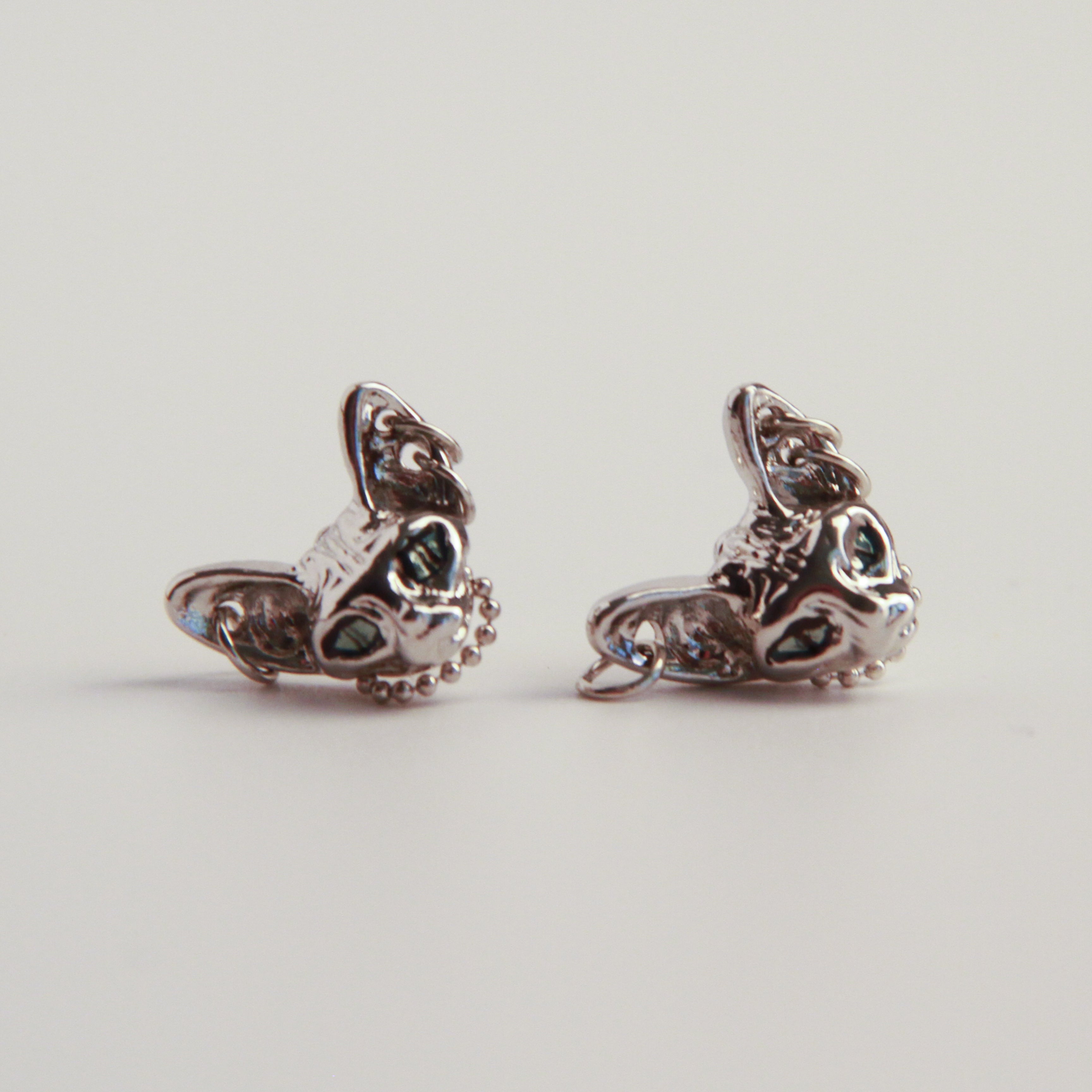 Silver cat earrings with detailed Sphynx-inspired design, elegant statement jewelry