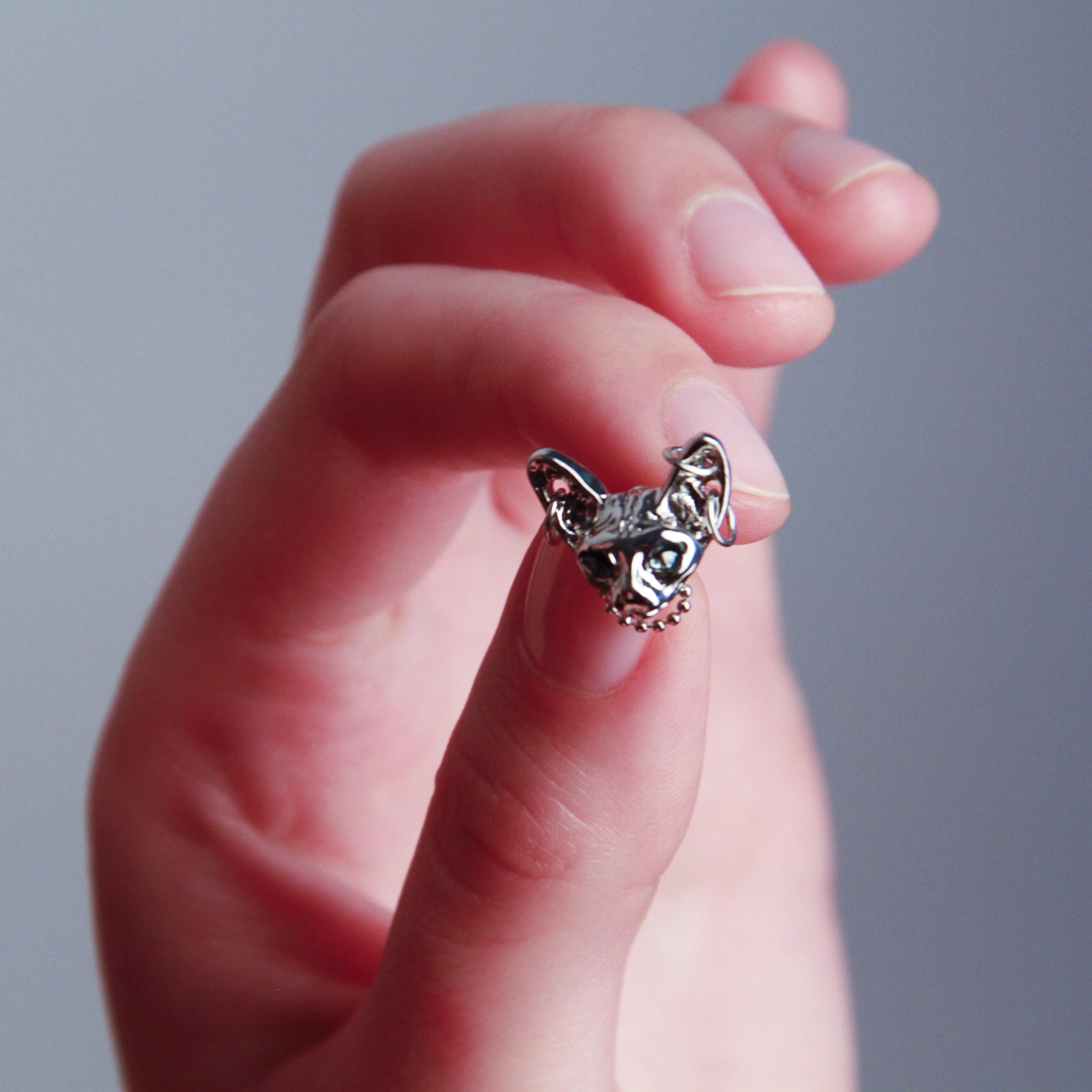 Silver cat earrings with detailed Sphynx-inspired design, elegant statement jewelry2