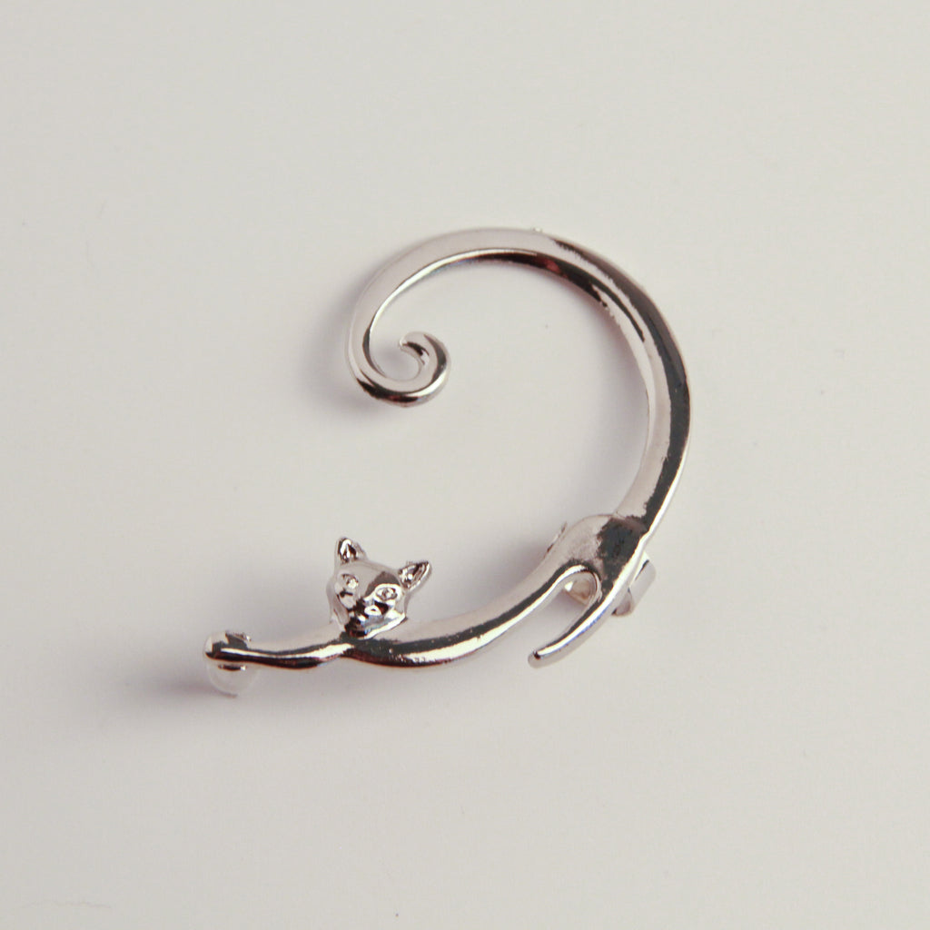 Minimalist silver cat earrings with playful charm accents, lightweight accessory for everyday wear