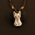 White Bastet cat necklace with blue eyes and gold Egyptian-inspired details