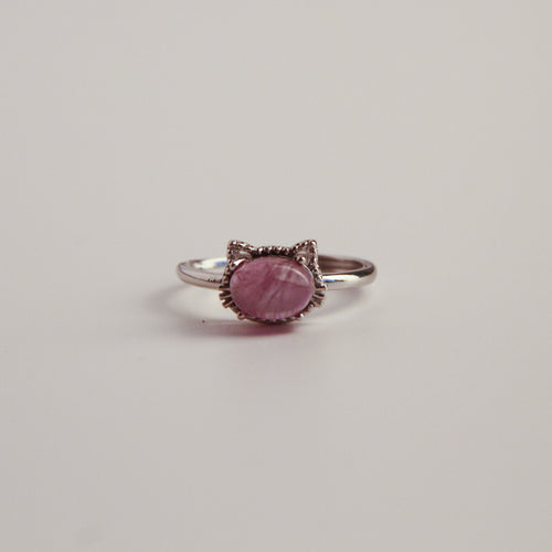 Metallic cat ring on a white background