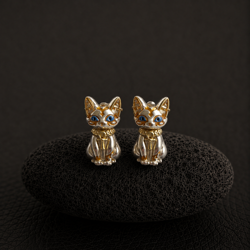 Bastet cat stud earrings with blue eyes and gold details
