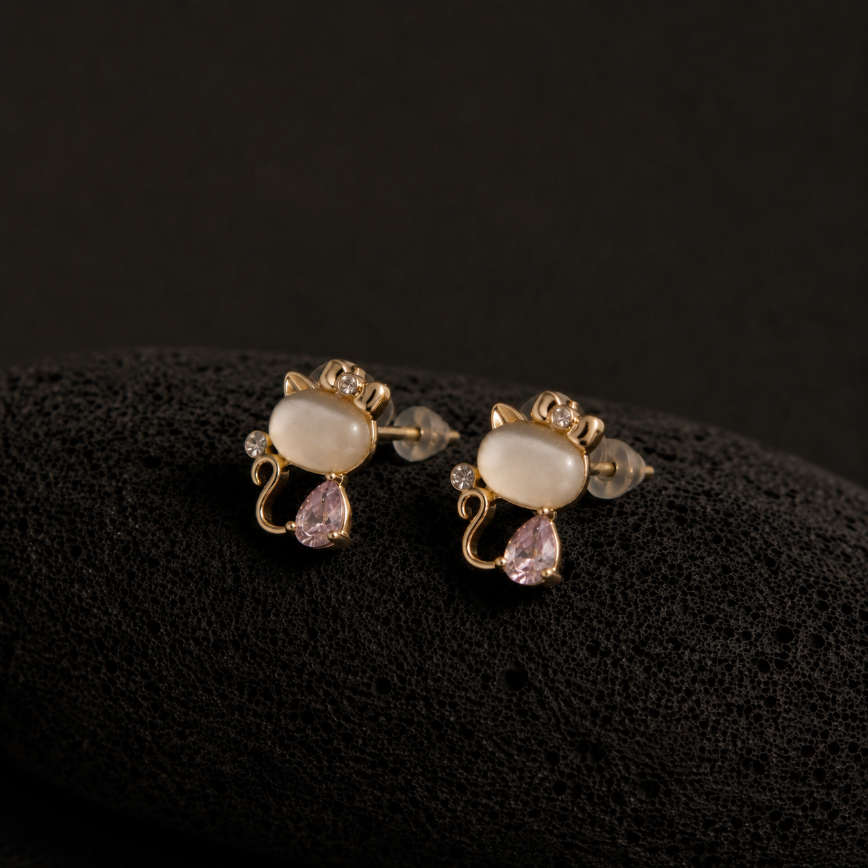 Blush Kitty cat earrings with pink teardrop stones and golden bows